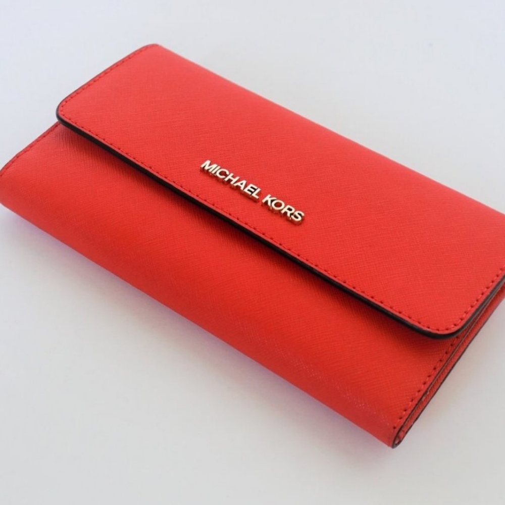 Beautiful MK wallet in red. New never used with tags. ❤
